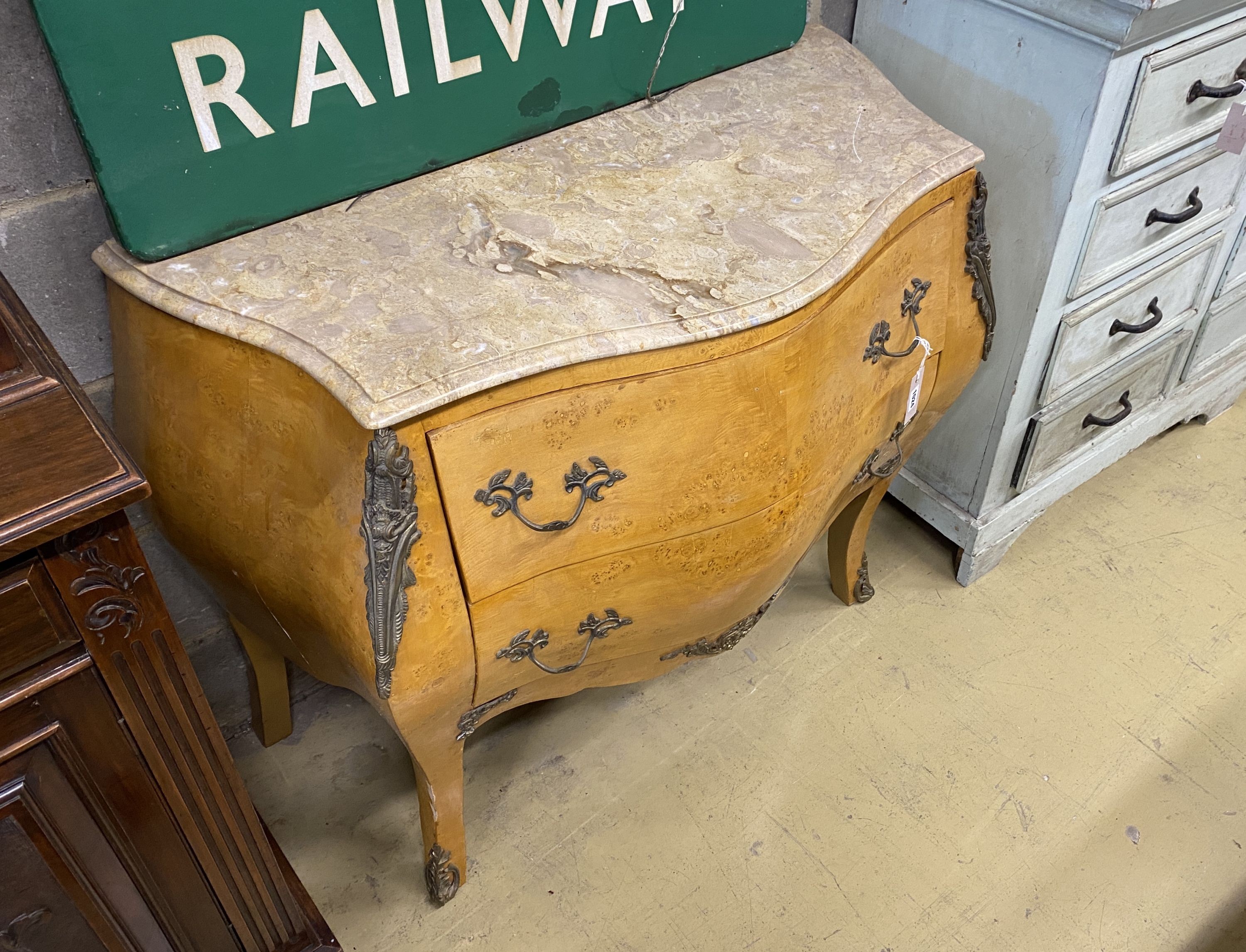 A Louis XVI style bird's eye maple marble top bombe commode, width 106cm, depth 48cm, height 87cm